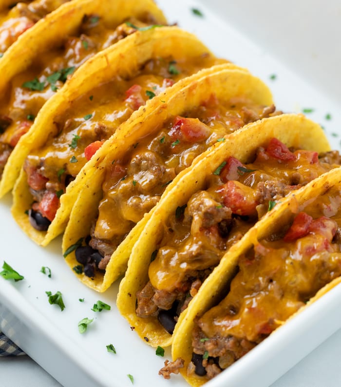 Baked Tacos with beef and cheese in a casserole dish.