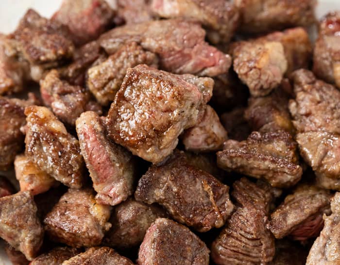 Seared cubes of stew meat for making beef stroganoff.
