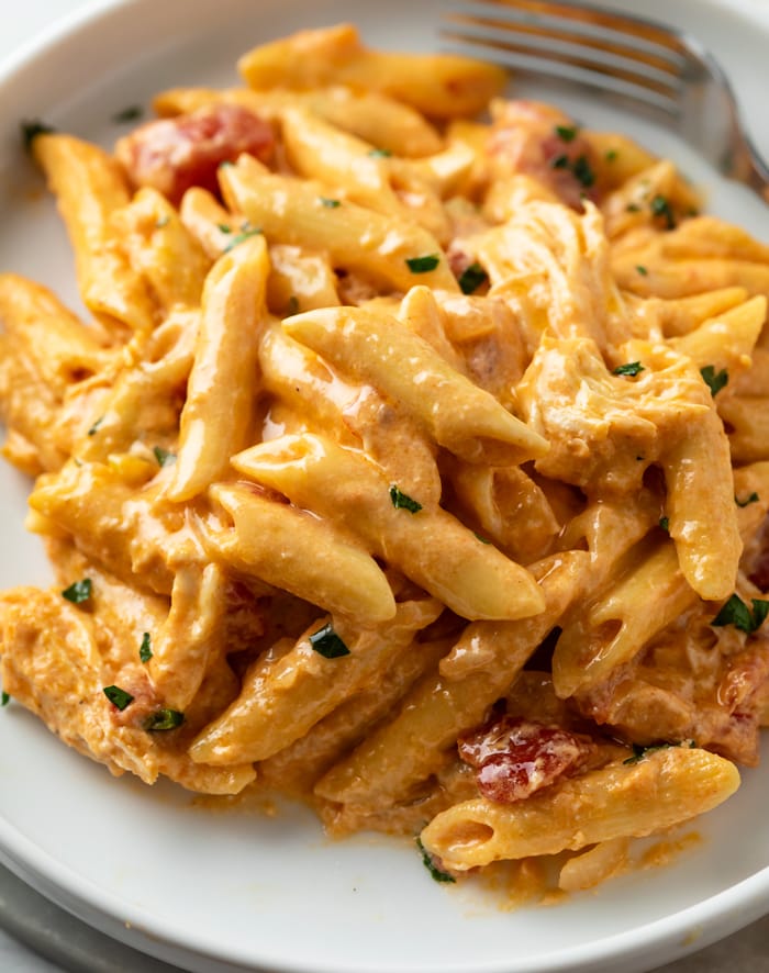 A white plate topped with creamy Buffalo Chicken Pasta.