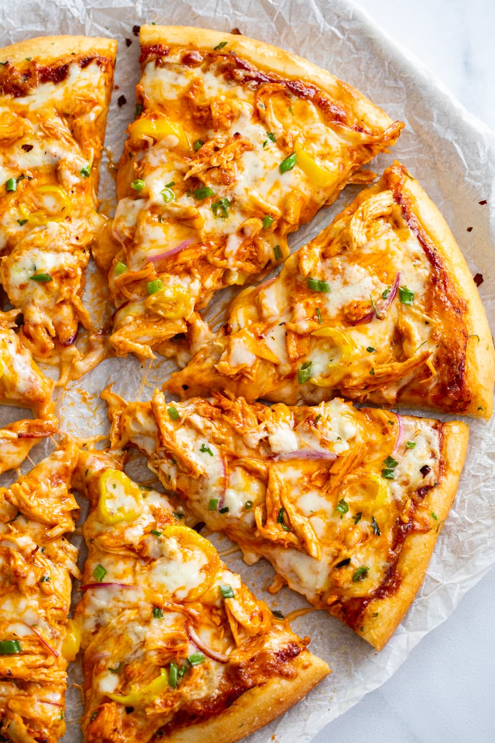 Buffalo Chicken Pizza with buffalo sauce and blue cheese.