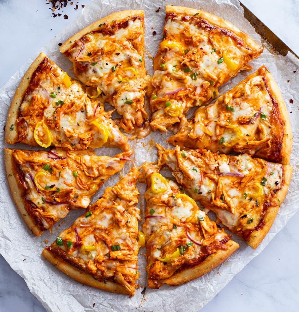Buffalo Chicken Pizza cut into 8 slices with toppings.