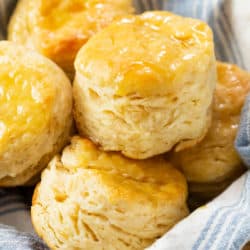 A bowl filled with fluffy Buttermilk Biscuits.