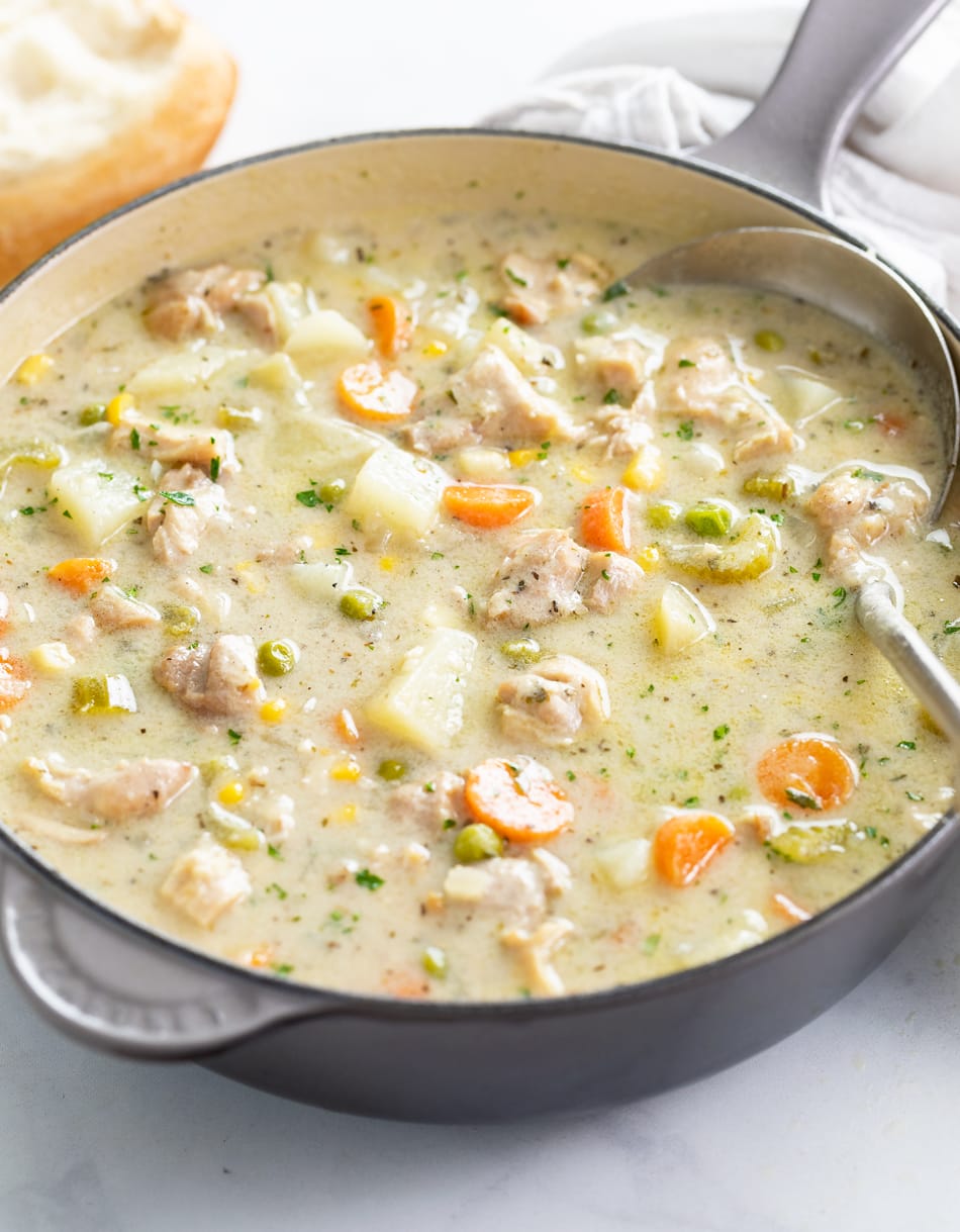 Creamy Chicken Soup in a soup pot with a ladle.