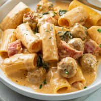 A plate with Creamy Sausage Pasta with Rigatoni.