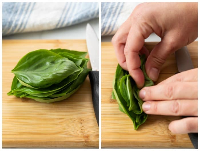 Rolling up a stack of basil leaves to chiffonade them.