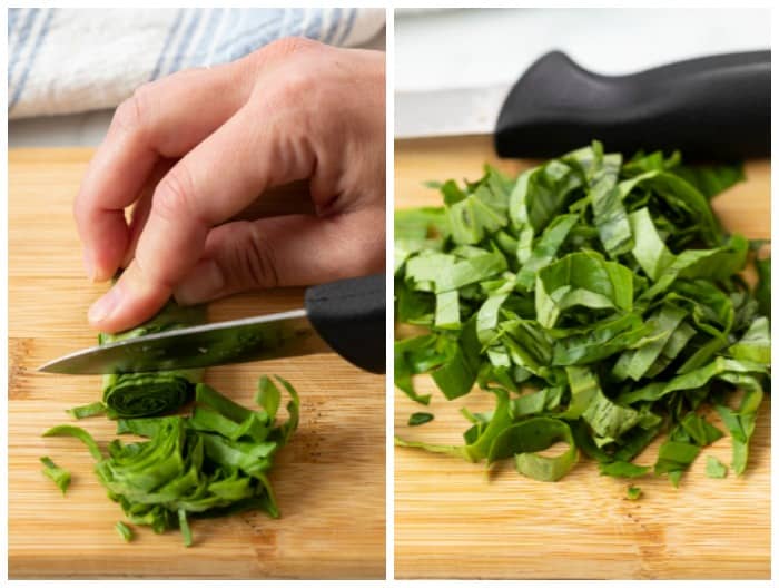 Cutting into a roll of basil to chiffonade it.