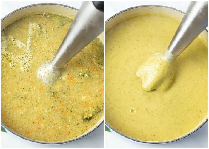 An immersion blender in a pot blending broth for cream of broccoli soup.