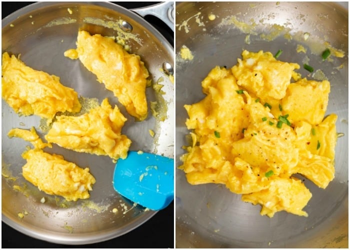 Finishing scrambled eggs in a pan and topping them with chives, salt, and pepper at the end.