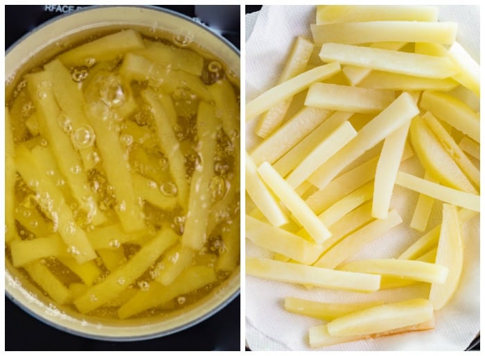 Lightly boiling sliced potatoes to make homemade french fries.