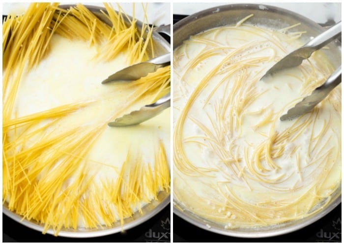 Angel hair pasta being added to cream sauce for Garlic Parmesan Pasta