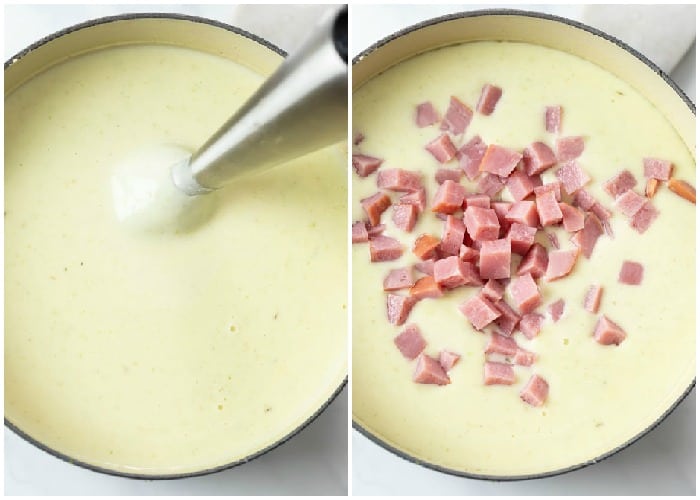 An immersion blender in a pot of soup with ham being added for ham and potato soup.