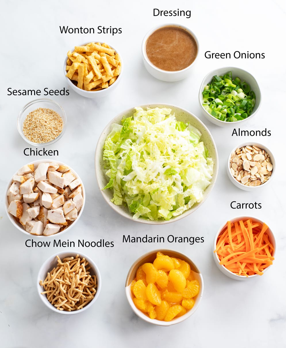 Labeled ingredients for making Chinese Chinese Salad on a white surface.