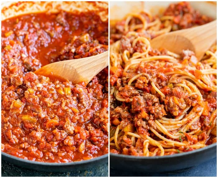 A skillet filled with bolognese sauce with spaghetti being added to it.