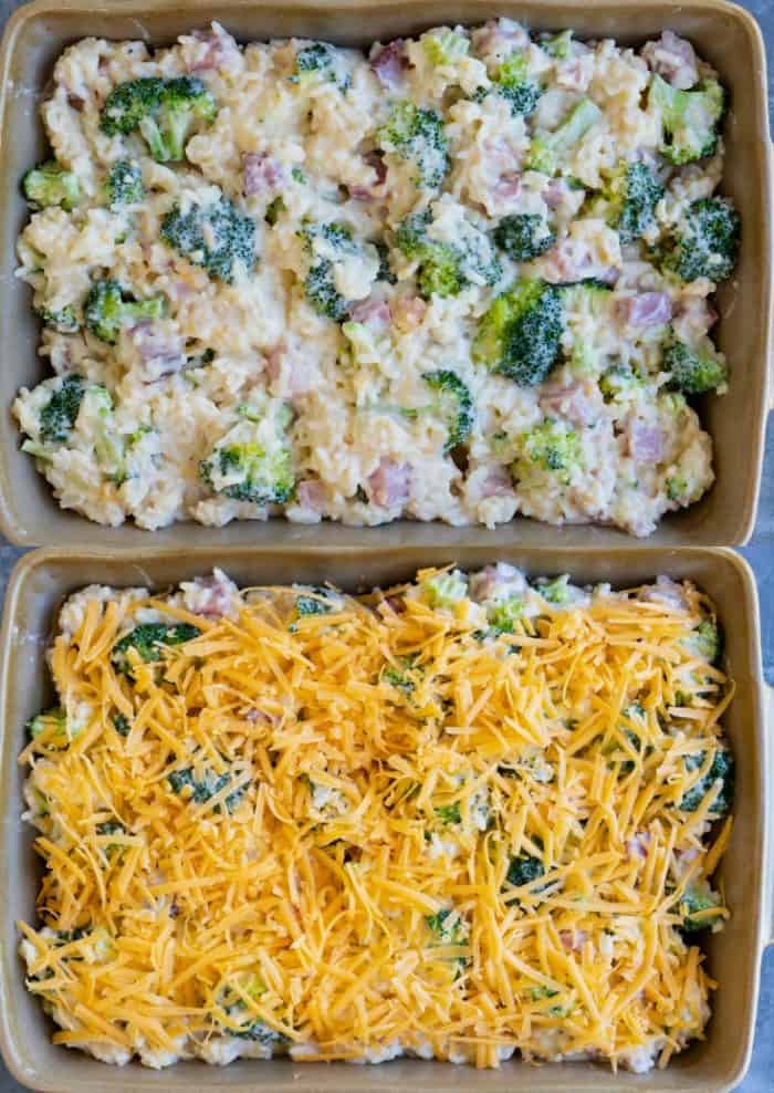 casserole dish filled with uncooked ham casserole ingredients and topped with grated cheese.