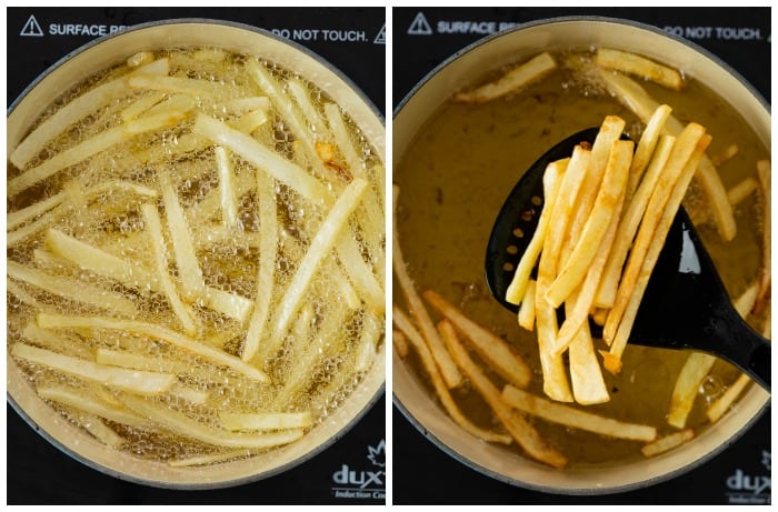 French fries being fried in a dutch oven until golden and crispy.
