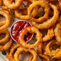 These homemade onion rings are deep fried in a flavorful batter and are so easy to make from scratch! Serve them with dipping sauce for fun appetizer idea.
