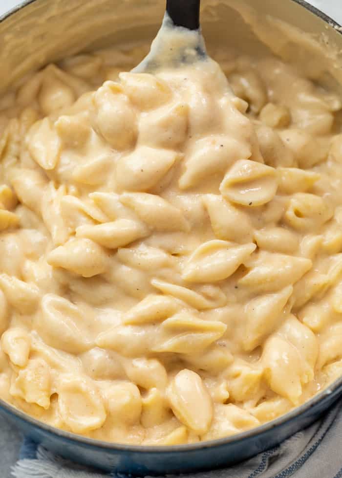 A pot full of creamy White Cheddar Shells and cheese for Panera Mac and Cheese recipe.