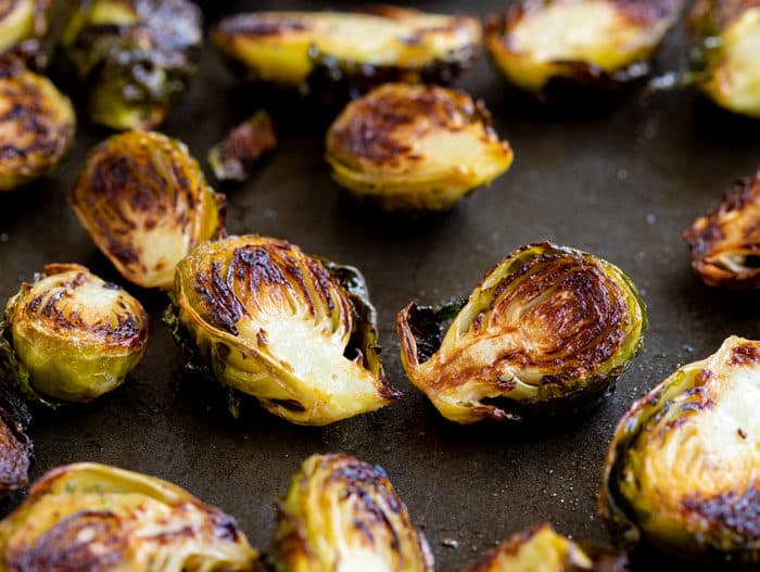 Roasted Brussels on a baking sheet.