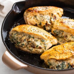 Stuffed Chicken Breast in a cast iron skillet.