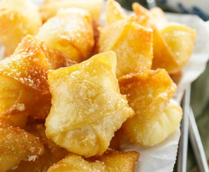 Golden Fried wontons folded up with sweet cream cheese filling inside.