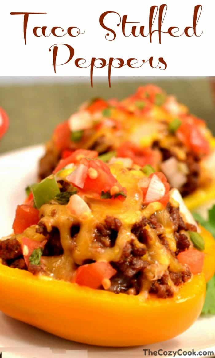 These savory taco stuffed peppers are filled with ground beef or turkey and sprinkled with your favorite taco toppings and melted cheese! #tacos #peppers #healthy #meat #protein #dinner #cheese #mexicanfood #groundbeef