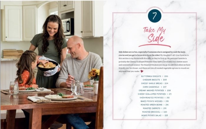 A family at a table eating a side of buttermilk biscuits in The Cozy Cookbook.