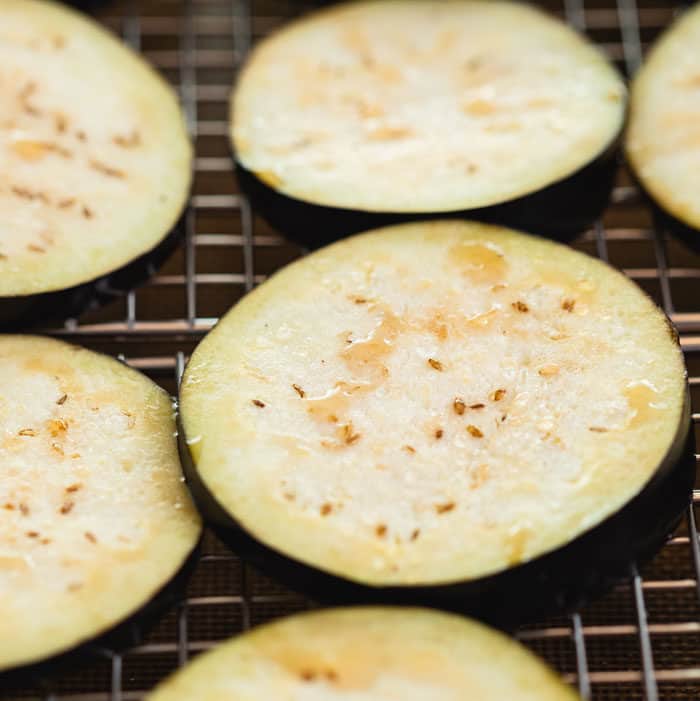 close up shot of an eggplant slice with moisture on top from salting it.